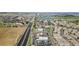 Expansive aerial view of a residential area, showcasing a mix of housing, roadways, and community amenities at 9792 Mayfair St # F, Englewood, CO 80112