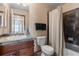 Cozy bathroom with slate tile accents, classic vanity, and shower/tub combo at 9792 Mayfair St # F, Englewood, CO 80112