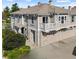 Beautiful two-story home with stone accents, a balcony, and a two-car garage, creating a welcoming curb appeal at 9792 Mayfair St # F, Englewood, CO 80112