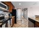 Clean kitchen featuring stainless steel appliances, ample counter space, and rich wood cabinetry at 9792 Mayfair St # F, Englewood, CO 80112