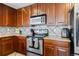 This updated kitchen features granite countertops, stainless steel appliances, and ample cabinet space at 9792 Mayfair St # F, Englewood, CO 80112