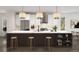 Bright, modern kitchen with marble countertops, stainless steel appliances, and stylish pendant lighting at 2417 S Lafayette St, Denver, CO 80210