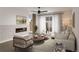 Cozy living room featuring an electric fireplace, neutral décor, and access to outdoor space at 2417 S Lafayette St, Denver, CO 80210