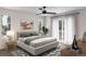Bright main bedroom with ceiling fan, balcony access, and contemporary design at 2417 S Lafayette St, Denver, CO 80210