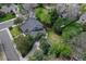 Aerial view of a home showcasing its well-maintained landscaping, private backyard, and driveway at 7295 S Steele Cir, Centennial, CO 80122