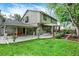 Exterior view of the house with a beautiful backyard, patio, and well-manicured lawn at 7295 S Steele Cir, Centennial, CO 80122