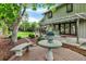 Spacious backyard with a patio, seating areas, and meticulously maintained greenery at 7295 S Steele Cir, Centennial, CO 80122