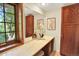 Bathroom vanity features marble countertop, wood cabinets, and natural lighting at 7295 S Steele Cir, Centennial, CO 80122