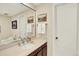 Bathroom featuring a vanity, sink, mirror, and decorative artwork at 7295 S Steele Cir, Centennial, CO 80122