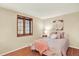 Cozy bedroom with natural lighting, wood floors and wood trim window at 7295 S Steele Cir, Centennial, CO 80122