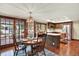 Inviting dining area with natural lighting, wood floors, and decorative chandelier at 7295 S Steele Cir, Centennial, CO 80122