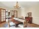 Formal dining room with dark wood accents and light walls, perfect for gatherings at 7295 S Steele Cir, Centennial, CO 80122