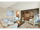 Comfortable living room with an inviting sofa, shelving, and a serene atmosphere at 7295 S Steele Cir, Centennial, CO 80122