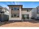 Backyard with a patio, neutral siding, and various windows at 7279 Prairie Sage Pl, Littleton, CO 80125