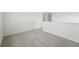 This carpeted bedroom features neutral walls and carpet at 7279 Prairie Sage Pl, Littleton, CO 80125