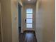 Hallway leading to front door with glass accents at 7279 Prairie Sage Pl, Littleton, CO 80125