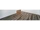 Close-up of the durable and stylish hardwood flooring, adding warmth to the space at 7279 Prairie Sage Pl, Littleton, CO 80125
