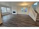 Spacious living room with hardwood floors, fireplace, and lots of natural light at 7279 Prairie Sage Pl, Littleton, CO 80125