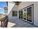 Outdoor patio with sliding glass doors, offering a smooth transition to indoor living at 7279 Prairie Sage Pl, Littleton, CO 80125