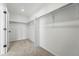 Spacious walk-in closet with neutral carpet, overhead light, and ample storage with hanging rods at 7279 Prairie Sage Pl, Littleton, CO 80125