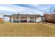 A spacious backyard with a covered patio, offering outdoor lounging and play area at 3041 S Glencoe St, Denver, CO 80222