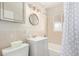 Clean and classic bathroom with tiled walls, vanity, and shower-tub combination at 3041 S Glencoe St, Denver, CO 80222