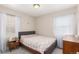 Cozy bedroom with a comfortable bed and soft, natural lighting at 3041 S Glencoe St, Denver, CO 80222