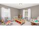 Spacious bedroom featuring plenty of room for play and natural light at 3041 S Glencoe St, Denver, CO 80222