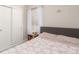 Comfortable bedroom featuring a closet, window and bedside table at 3041 S Glencoe St, Denver, CO 80222