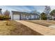 Charming single-story home with a long driveway and a one-car attached garage at 3041 S Glencoe St, Denver, CO 80222