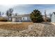 Beautifully maintained home featuring a lush front yard and an attached garage, creating a welcoming curb appeal at 3041 S Glencoe St, Denver, CO 80222