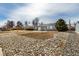 Charming home with a unique rock-lined front yard, enhancing curb appeal and visual interest at 3041 S Glencoe St, Denver, CO 80222