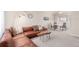 Cozy living room featuring a comfortable leather couch, carpeted floors, and natural light at 3041 S Glencoe St, Denver, CO 80222