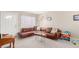 Bright living room with a comfortable leather sofa and large windows for natural light at 3041 S Glencoe St, Denver, CO 80222