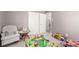 Playroom with a neutral color palette with an open doorway to the bathroom at 3041 S Glencoe St, Denver, CO 80222