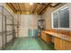 Basement workshop with ample storage shelving at 11822 Meadowood Ln, Parker, CO 80138