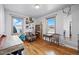 Bedroom with hardwood floors, large window, unique decor, and a cozy reading nook at 1730 W 51St Ave, Denver, CO 80221