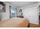Bedroom featuring hardwood floors, and natural light from a bright window at 1730 W 51St Ave, Denver, CO 80221