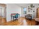 Bedroom featuring hardwood floors, large window, unique decor, and a cozy reading nook at 1730 W 51St Ave, Denver, CO 80221