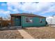 Inviting single-story home with a covered porch and well-maintained front yard at 1730 W 51St Ave, Denver, CO 80221