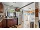 Bright kitchen with stainless steel refrigerator, decorative window and a door to the outside at 1730 W 51St Ave, Denver, CO 80221