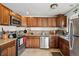Well-appointed kitchen featuring stainless steel appliances and stylish countertops at 1730 W 51St Ave, Denver, CO 80221