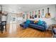 Open-concept living area featuring modern furniture and ample natural light at 1730 W 51St Ave, Denver, CO 80221