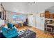 Bright living room with hardwood floors, natural light, and an open floor plan at 1730 W 51St Ave, Denver, CO 80221