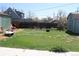 Spacious backyard with mature trees, a storage shed, and ample green space at 1730 W 51St Ave, Denver, CO 80221