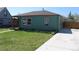 Charming home exterior showcasing the yard and well-maintained lawn at 1730 W 51St Ave, Denver, CO 80221