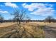 View of neighborhood park, featuring a playground, open green space, and mature trees offering ample shade at 1730 W 51St Ave, Denver, CO 80221
