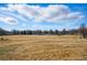 A spacious park with sparse trees offers ample space for recreation and relaxation in the community at 1730 W 51St Ave, Denver, CO 80221