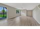 Open basement floor plan featuring wood-look floors and glass sliding doors at 3689 Primrose Ln, Castle Rock, CO 80109