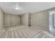 Spacious basement with neutral carpet and paint with a closet on the side at 3689 Primrose Ln, Castle Rock, CO 80109